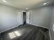 Well-lit bedroom with new floors and closet, providing a comfortable living space at 2911 E 35Th St, Indianapolis, IN 46218