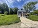 Charming home featuring a well-maintained lawn, a driveway, and a welcoming front porch at 2911 E 35Th St, Indianapolis, IN 46218