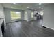 Open-concept living space featuring new floors, a fireplace, and an eat-in kitchen at 2911 E 35Th St, Indianapolis, IN 46218