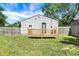 Here is a view of the back of the home, showing the fenced in yard and wood deck at 2936 N Gladstone Ave, Indianapolis, IN 46218