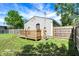 Here is a view of the back of the home, showing the fenced in yard and wood deck at 2936 N Gladstone Ave, Indianapolis, IN 46218