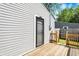 Back of home featuring a wood deck and backyard access with a secure metal gate at 2936 N Gladstone Ave, Indianapolis, IN 46218