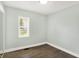 Bright bedroom features new floors, fresh paint, and natural light from the window at 2936 N Gladstone Ave, Indianapolis, IN 46218