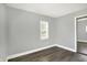 Bedroom features new floors, fresh paint, and natural light from the window and closet at 2936 N Gladstone Ave, Indianapolis, IN 46218