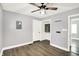 Freshly painted bedroom features a ceiling fan, updated closet, and new floors at 2936 N Gladstone Ave, Indianapolis, IN 46218