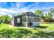 Charming home with a quaint front porch and lush green lawn at 2936 N Gladstone Ave, Indianapolis, IN 46218