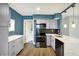 Modern kitchen features stainless appliances, light gray cabinetry, countertops, and updated finishes at 2936 N Gladstone Ave, Indianapolis, IN 46218