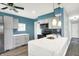 Modern kitchen featuring attractive white cabinetry, stainless appliances, and attractive lighting at 2936 N Gladstone Ave, Indianapolis, IN 46218