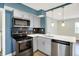 Updated kitchen features stainless steel appliances, modern cabinetry, and stylish countertops at 2936 N Gladstone Ave, Indianapolis, IN 46218