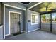 Comfortable enclosed front porch featuring a storm door and ceiling fan at 2936 N Gladstone Ave, Indianapolis, IN 46218