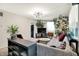 Bright living room with natural light, stylish decor, and comfortable seating at 332 Campus Ln, Indianapolis, IN 46219