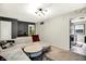 Well-lit living room with a comfortable sectional sofa and access to the kitchen at 332 Campus Ln, Indianapolis, IN 46219