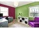 Inviting office space featuring two-tone walls, storage shelves, and a comfortable purple chair at 332 Campus Ln, Indianapolis, IN 46219