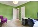 Versatile green office space with ample natural light and plenty of room for a desk and chair at 332 Campus Ln, Indianapolis, IN 46219