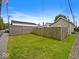 Large backyard, featuring a sturdy wooden fence for privacy, and ample green space at 334 E Pennsylvania St, Shelbyville, IN 46176
