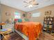 Comfortable bedroom with soft lighting, showcasing a neatly made bed and decorative shelving at 334 E Pennsylvania St, Shelbyville, IN 46176