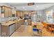 Cozy kitchen with wood cabinets, stainless steel appliances, granite counters, and a movable center island at 334 E Pennsylvania St, Shelbyville, IN 46176