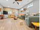 Spacious living room with wood-look floors and light-filled windows, offering comfortable seating arrangements at 334 E Pennsylvania St, Shelbyville, IN 46176