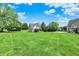 Spacious backyard offers ample green space for recreation and relaxation at 3398 Nottinghill Blvd, Plainfield, IN 46168