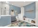 Well-lit blue bathroom featuring modern fixtures, storage, and stylish accents at 3398 Nottinghill Blvd, Plainfield, IN 46168