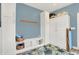 Bathroom with ample storage cabinets, a bench, and charming decor at 3398 Nottinghill Blvd, Plainfield, IN 46168