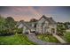 Impressive home exterior with manicured lawn, mature trees, and elegant design at 3398 Nottinghill Blvd, Plainfield, IN 46168
