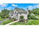 Beautiful brick home showcases meticulous landscaping, well-manicured lawn, and architectural details at 3398 Nottinghill Blvd, Plainfield, IN 46168