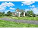 Stunning home exterior boasts professionally landscaped grounds and a circular driveway at 3398 Nottinghill Blvd, Plainfield, IN 46168