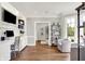 Comfortable home office with custom built-ins, desk and chairs, and a sitting area in natural light at 3398 Nottinghill Blvd, Plainfield, IN 46168