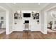 Beautiful home office with built-in shelving, white cabinets, and a comfortable workspace for productivity at 3398 Nottinghill Blvd, Plainfield, IN 46168