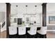 This kitchen boasts a large island, stainless appliances, granite countertops, and natural light at 3398 Nottinghill Blvd, Plainfield, IN 46168