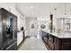 The modern kitchen offers granite counters, stainless appliances, and an open layout at 3398 Nottinghill Blvd, Plainfield, IN 46168