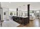 Open concept kitchen with island, pendant lights, stainless appliances, and view of the living area at 3398 Nottinghill Blvd, Plainfield, IN 46168