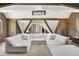 Comfortable living room featuring a sectional sofa, exposed beams, and unique architectural elements at 3398 Nottinghill Blvd, Plainfield, IN 46168
