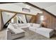 Bright living room featuring exposed beams, a sectional sofa with a chaise lounge, and unique architectural elements at 3398 Nottinghill Blvd, Plainfield, IN 46168