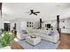Cozy living room showcases an open layout, hardwood floors, and lots of natural light at 3398 Nottinghill Blvd, Plainfield, IN 46168