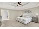 Large primary bedroom with tray ceiling, carpet, and neutral paint tones at 3398 Nottinghill Blvd, Plainfield, IN 46168