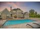 Inviting backyard pool area with lounge chairs, perfect for relaxation and entertainment at 3398 Nottinghill Blvd, Plainfield, IN 46168