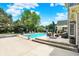 A beautiful swimming pool is surrounded by an outdoor kitchen and seating areas at 3398 Nottinghill Blvd, Plainfield, IN 46168