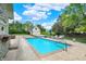 Beautiful swimming pool in the backyard of this home with a large travertine patio at 3398 Nottinghill Blvd, Plainfield, IN 46168