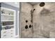 Shower with bronze fixtures and beige tiled walls, and white shelving at 3398 Nottinghill Blvd, Plainfield, IN 46168