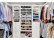 Organized walk-in closet with built-in shelving, drawers, and hanging rods for ample storage at 3398 Nottinghill Blvd, Plainfield, IN 46168