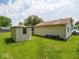 Spacious backyard featuring well-maintained lawn, shed and detached garage at 3538 Whalen Ave, Indianapolis, IN 46227