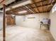 Unfinished basement space with painted walls and ceiling and concrete flooring at 3538 Whalen Ave, Indianapolis, IN 46227