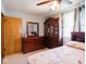 Well-lit bedroom with hardwood furniture, neutral walls, and comfortable carpeting at 3538 Whalen Ave, Indianapolis, IN 46227