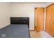 Simple bedroom with closet space and natural light; perfect for a comfortable night's sleep at 3538 Whalen Ave, Indianapolis, IN 46227