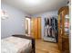 Cozy bedroom with hardwood floors, closet space, and neutral wall color at 3538 Whalen Ave, Indianapolis, IN 46227