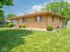 Charming brick ranch home with manicured lawn, showcasing its appealing exterior and landscaping at 3538 Whalen Ave, Indianapolis, IN 46227
