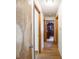 Hallway with hardwood floors leading to a bedroom and other areas of the home at 3538 Whalen Ave, Indianapolis, IN 46227