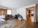 Bright living room featuring hardwood floors, a large window, and an open doorway at 3538 Whalen Ave, Indianapolis, IN 46227